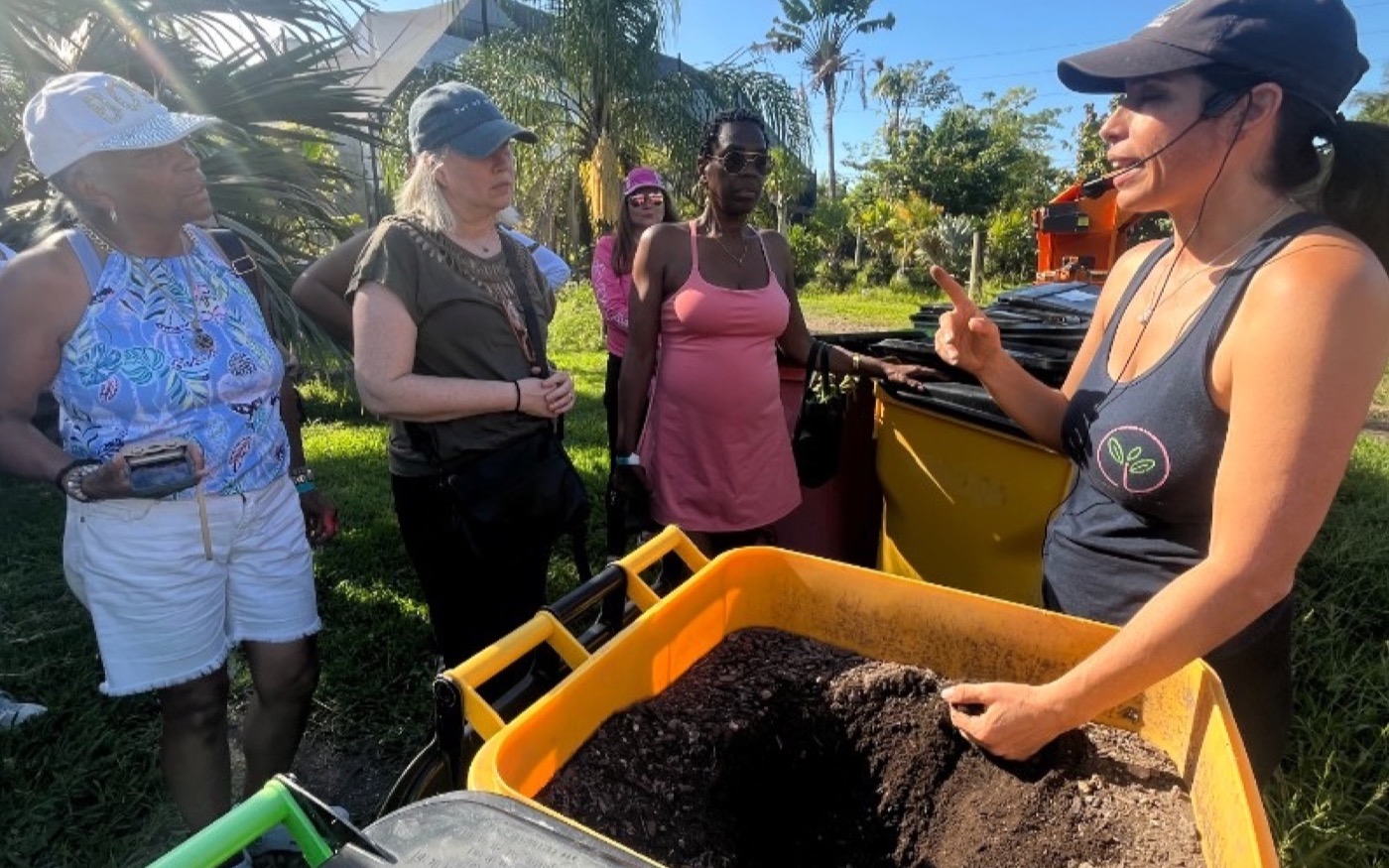 Soil and compost demonstration during the tour.
