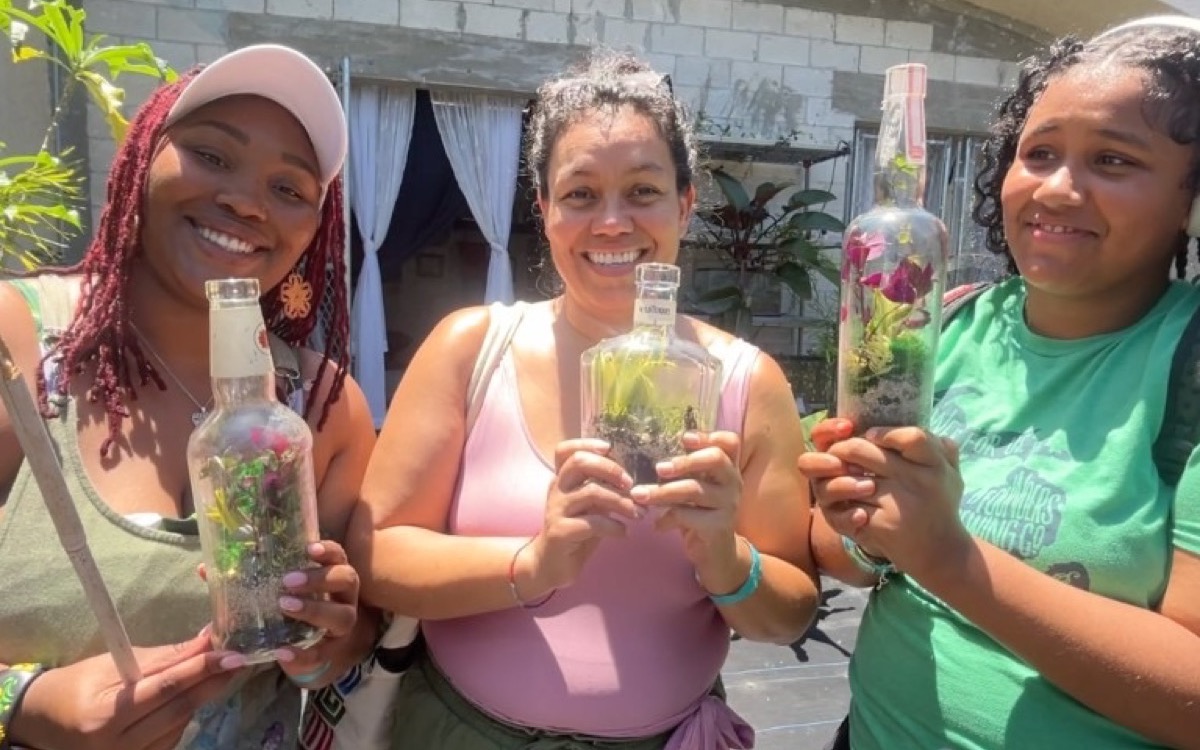 Guests holding handmade terrariums after the activity.