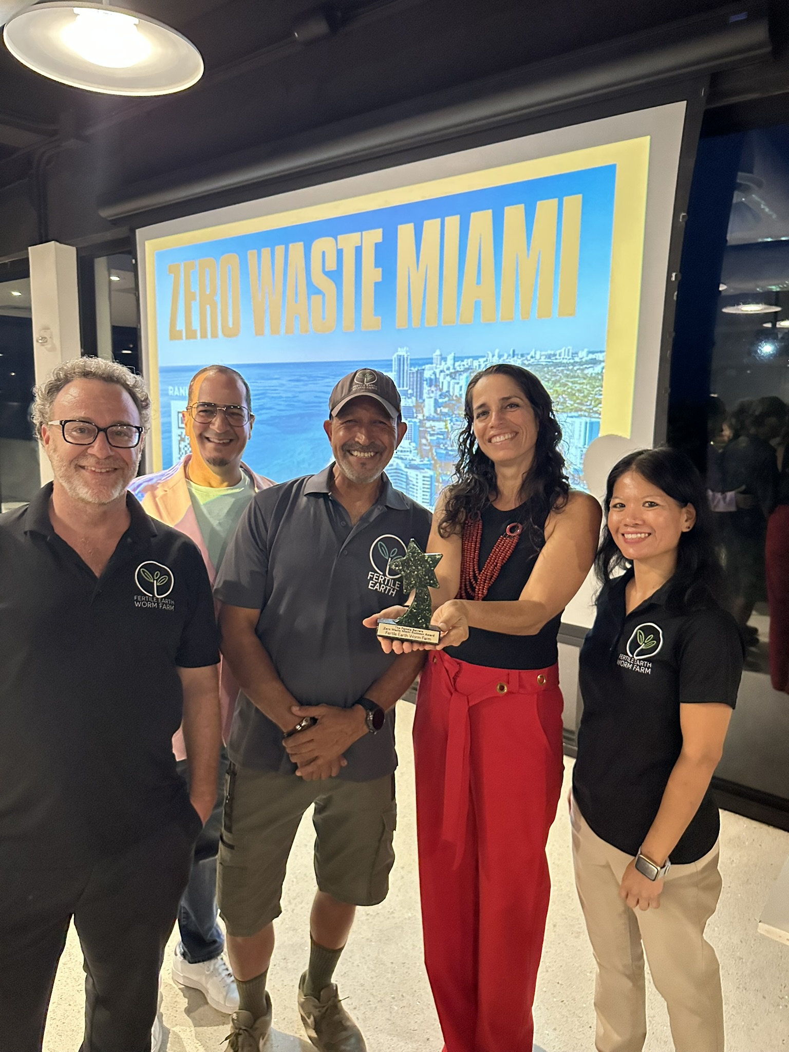 Fertile Earth receiving The Pamela Barrera Zero-Waste Business Award from Debris Free Oceans