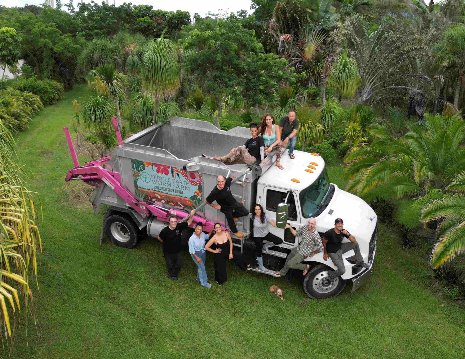 The Fertile Earth crew with a compost truck at their farm in Homestead, FL